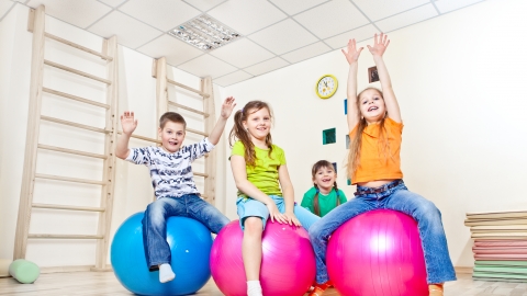 bigstock-Cheerful-kids-on-large-gym-bal-47188720.jpg